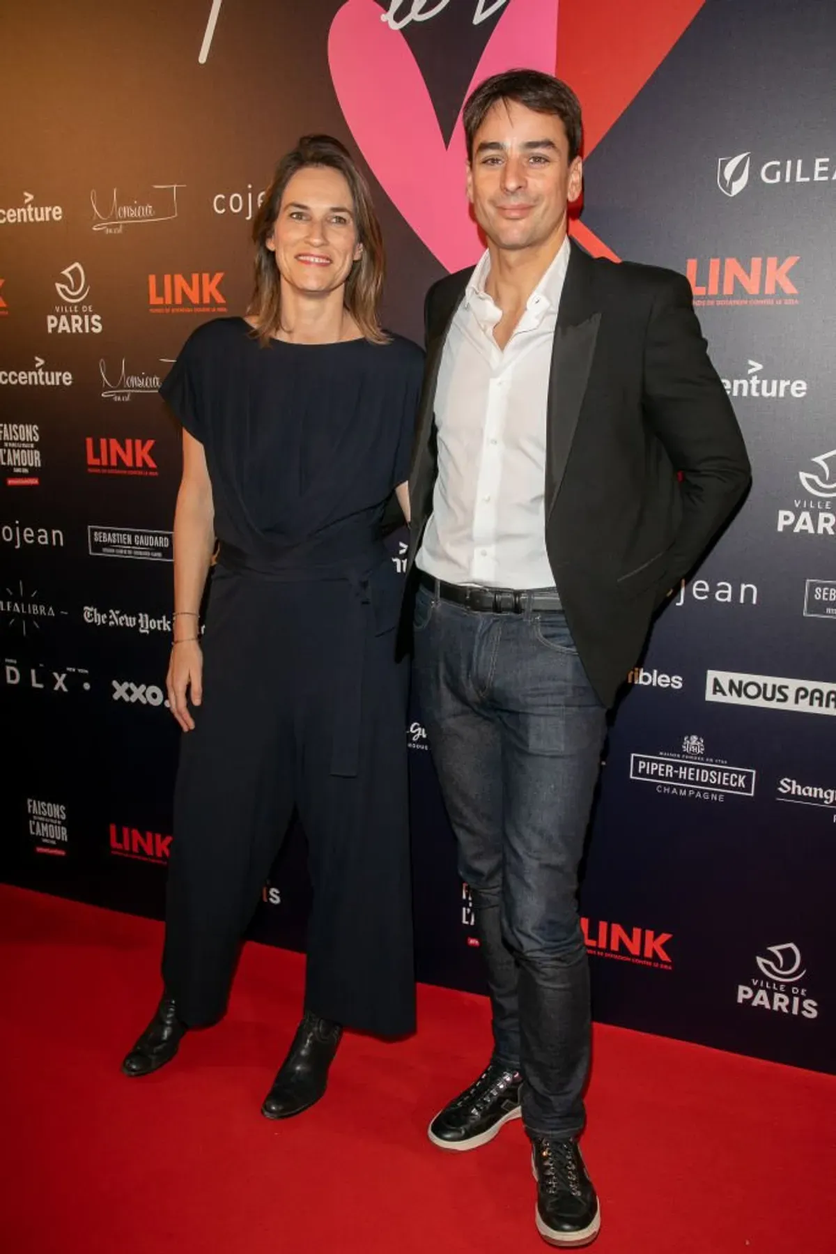 Claire Fournier et Julian Bugier assistent au gala de charité ''Par Amour'' à la Mairie de Paris le 14 février 2019 à Paris. | Photo : Getty Images