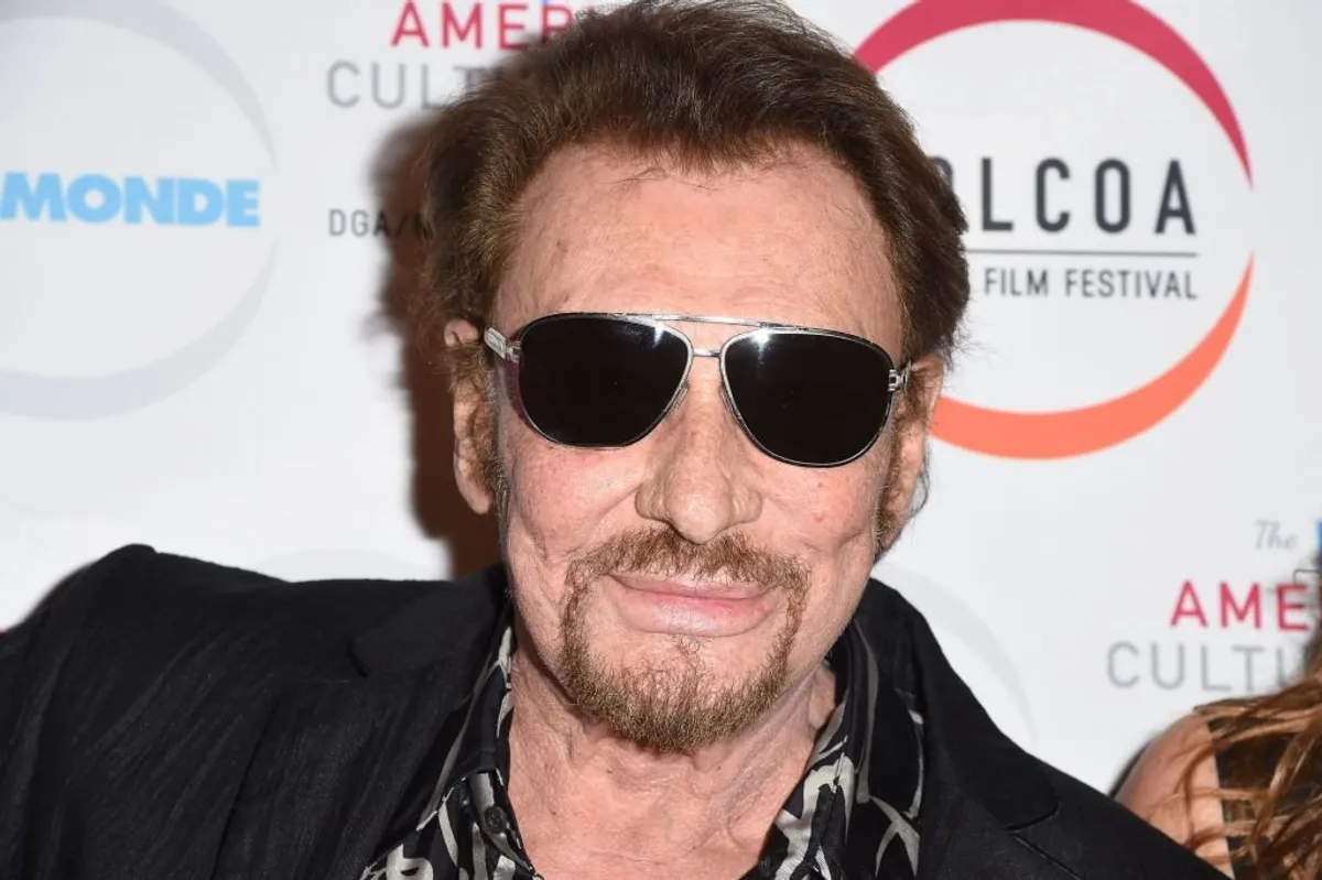 Johnny Hallyday assiste à la première de "Everyone's Life" lors de la soirée d'ouverture du Festival du film français COLCOA, le 24 avril 2017 à la Guilde des réalisateurs d'Amérique à Hollywood, en Californie. | Photo : Getty Images